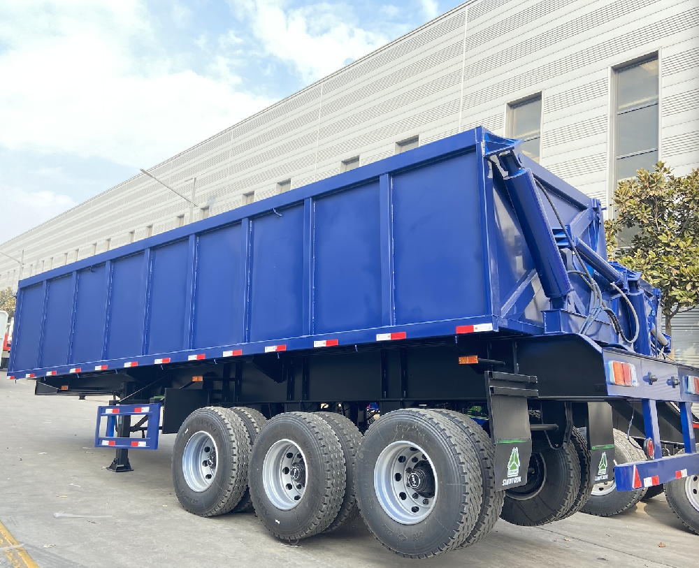 Tandem side dump semi-trailer